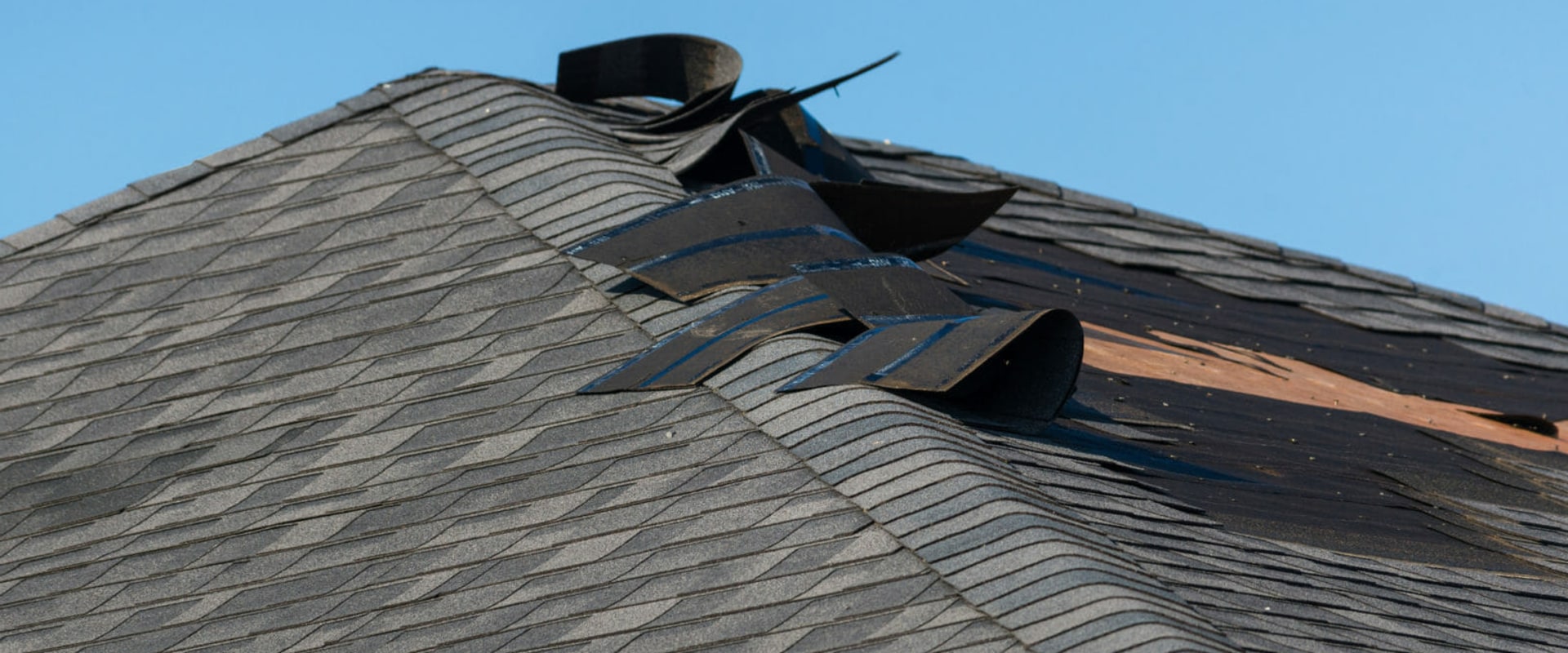 What are signs of a damaged roof?