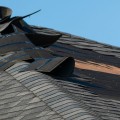 What are signs of a damaged roof?